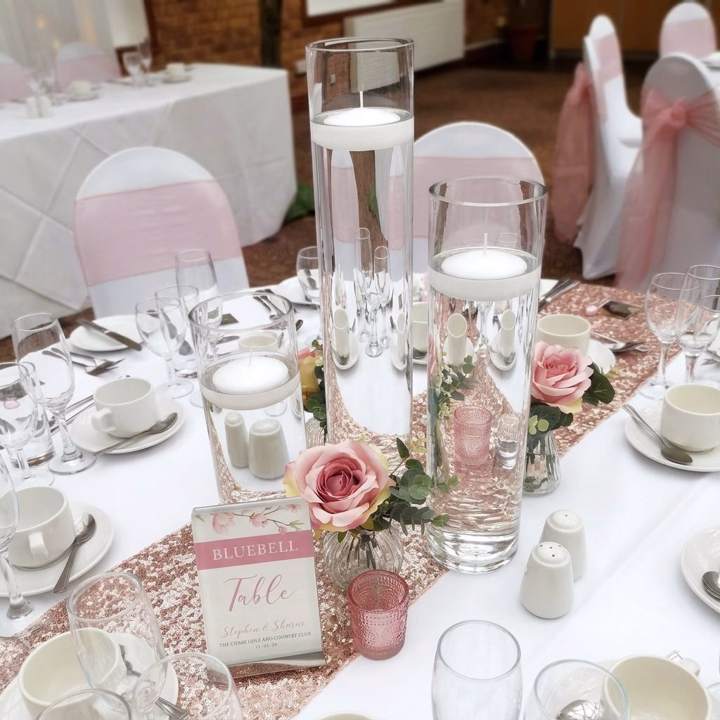 Cylinder vases with floating candles - Centerpieces
